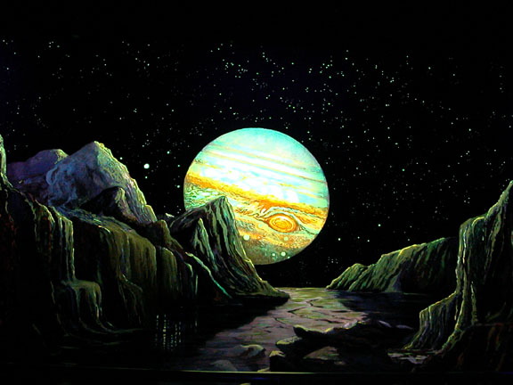 color image of jupiter with a rocky forground in neon glowing paint